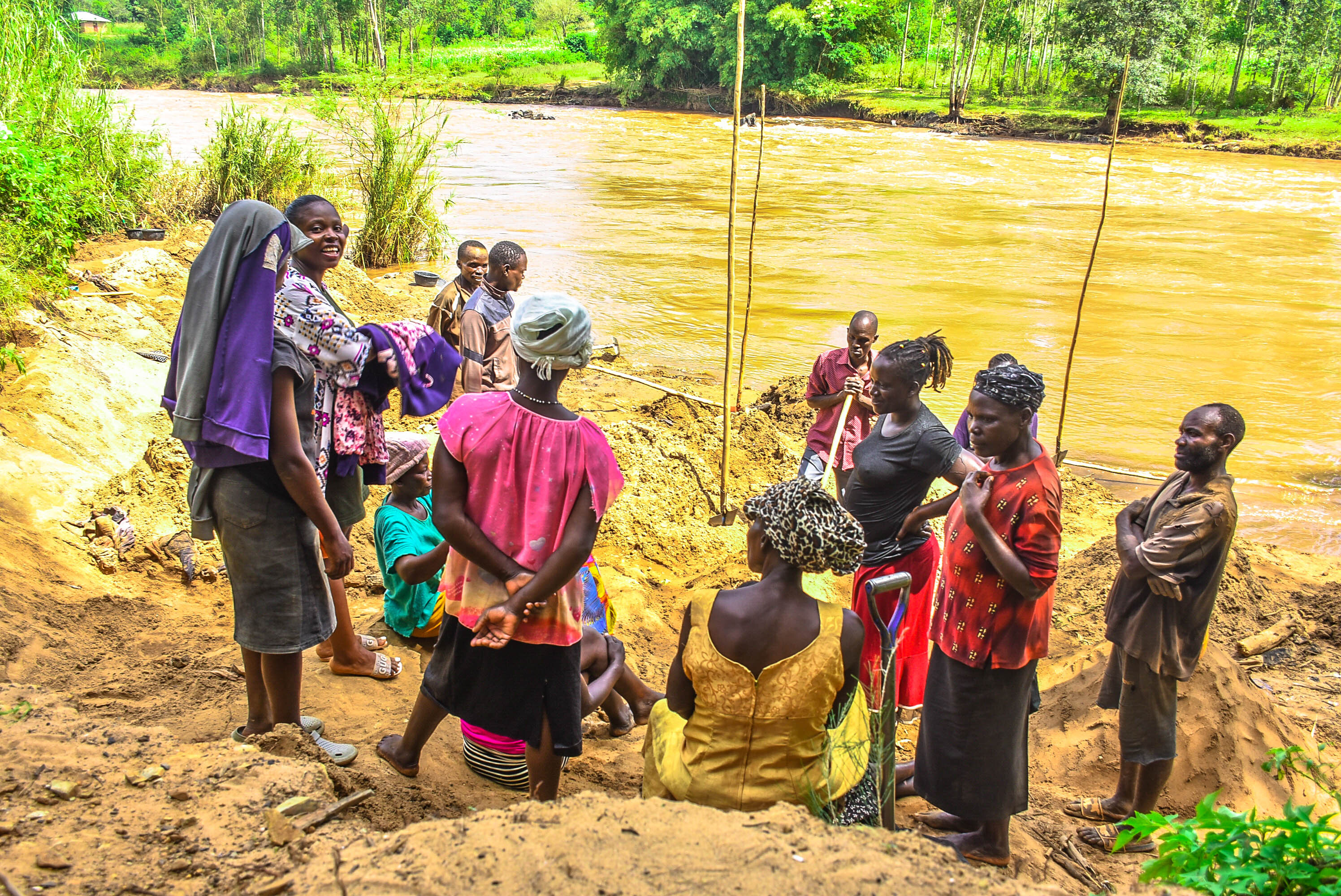 Gold miners on the banks of a river
