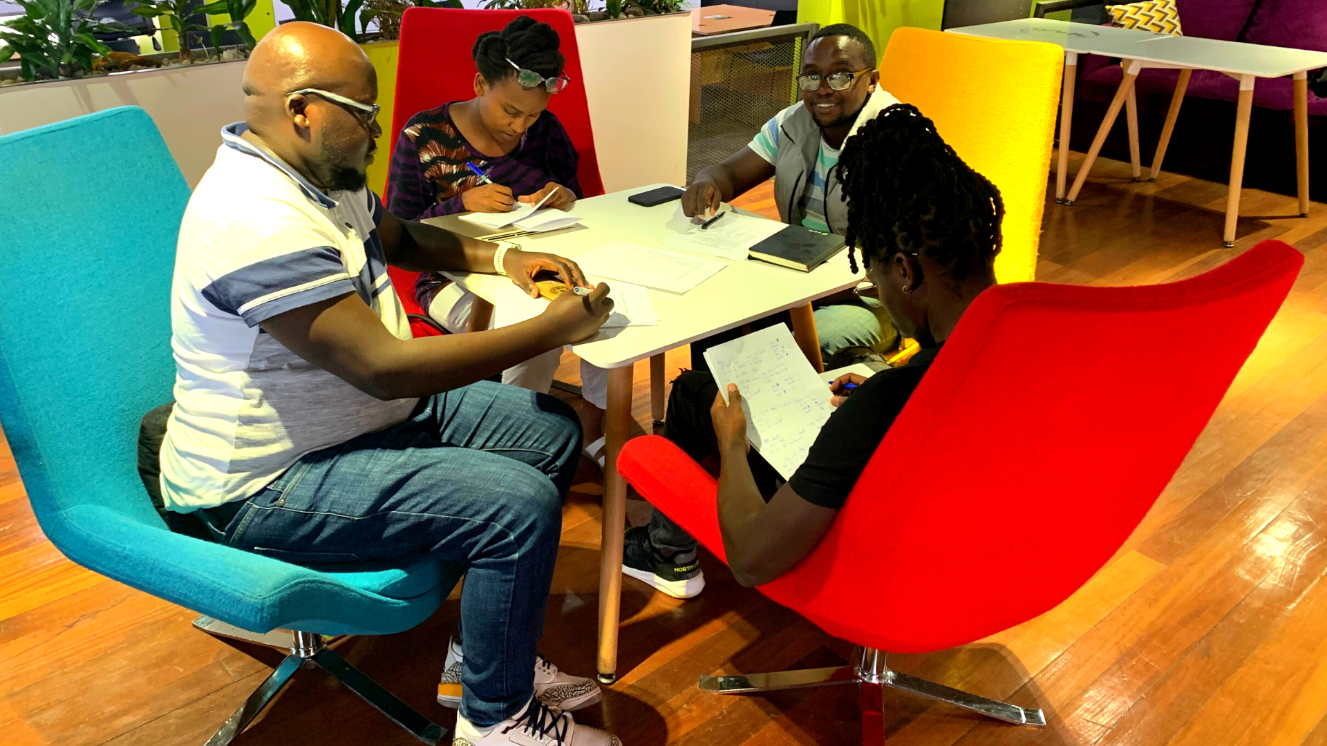 Judges evaluating the solutions presented during the Ushahidi Code Beyond Barriers Hackathon