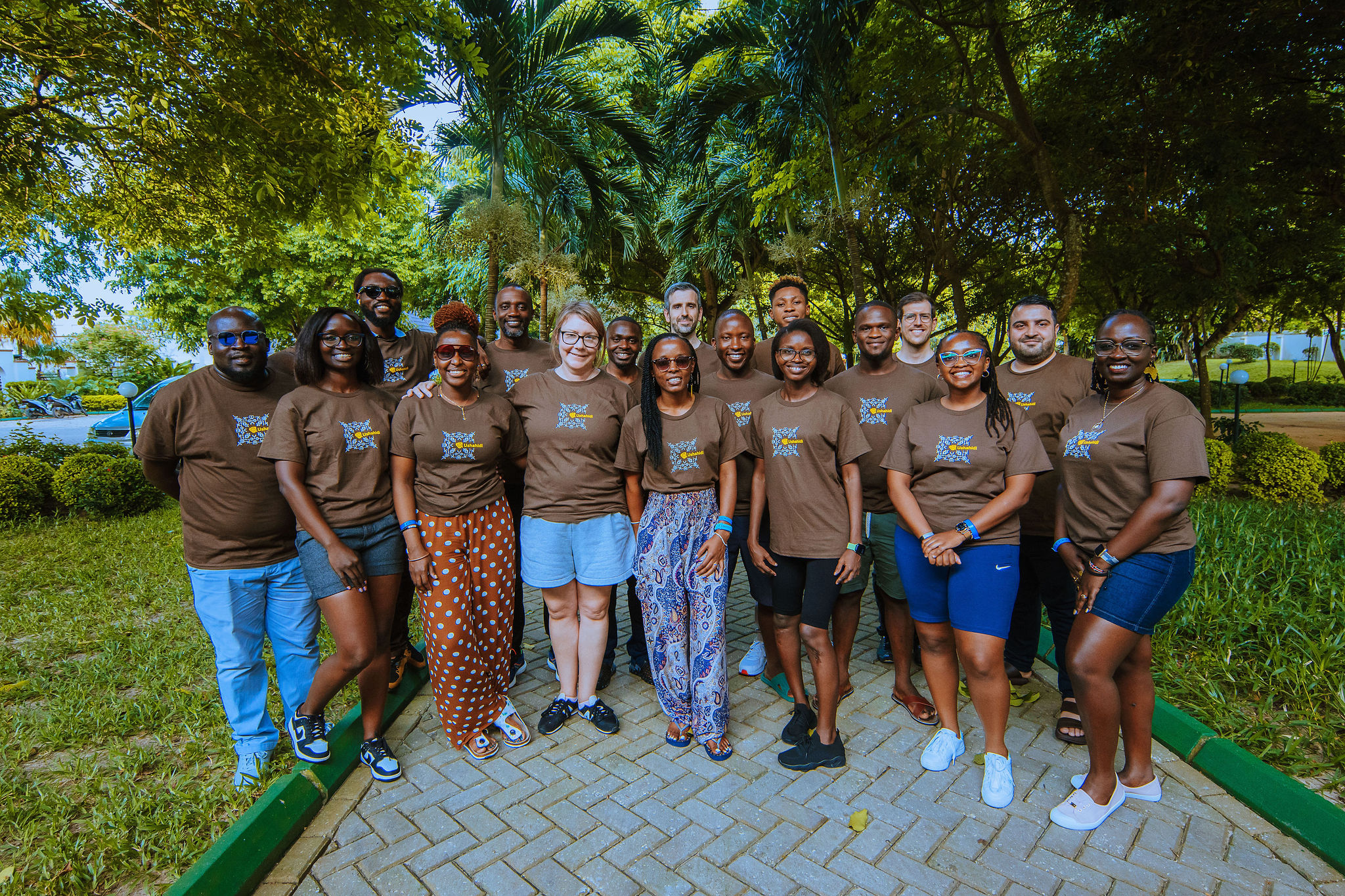 The team posing for a photo, wearing the Ushahidi t-shirts